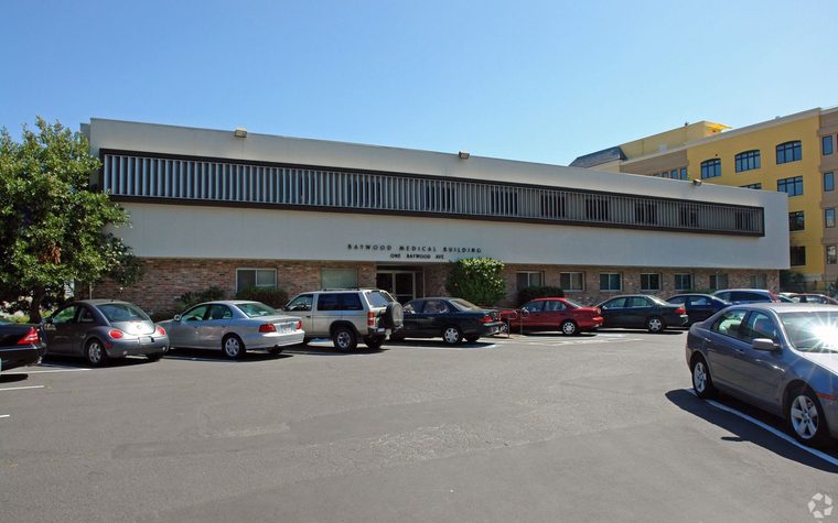 Two-storey office and flex building with surface parking